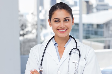 20s, Young Adult, Woman, Female, Caucasian, Indoors, Looking At Camera, Doctor, Practitioner, Profession, Professional, Specialist, Lab Coat, Stethoscope, Confident, Happy, Smile, Smiling, Standing, Clinic, Healthcare, Hospital, Medical, Staff, Attractive, Pretty, Brunette, Portrait